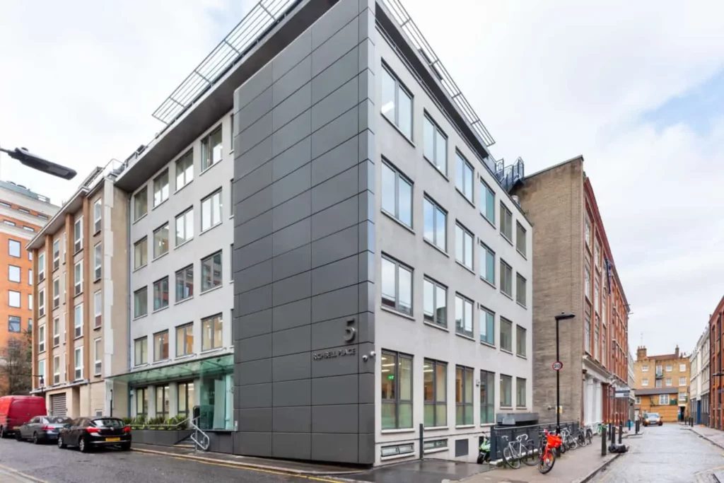 The exterior of Richbell Place in Holborn London, surrounded by parked cars and bicycles.